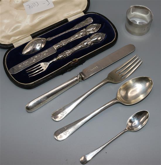 Two silver christening sets, a spoon and a napkin ring